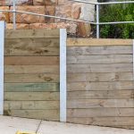 How to Build a Retaining Wall With Landscape Timbers