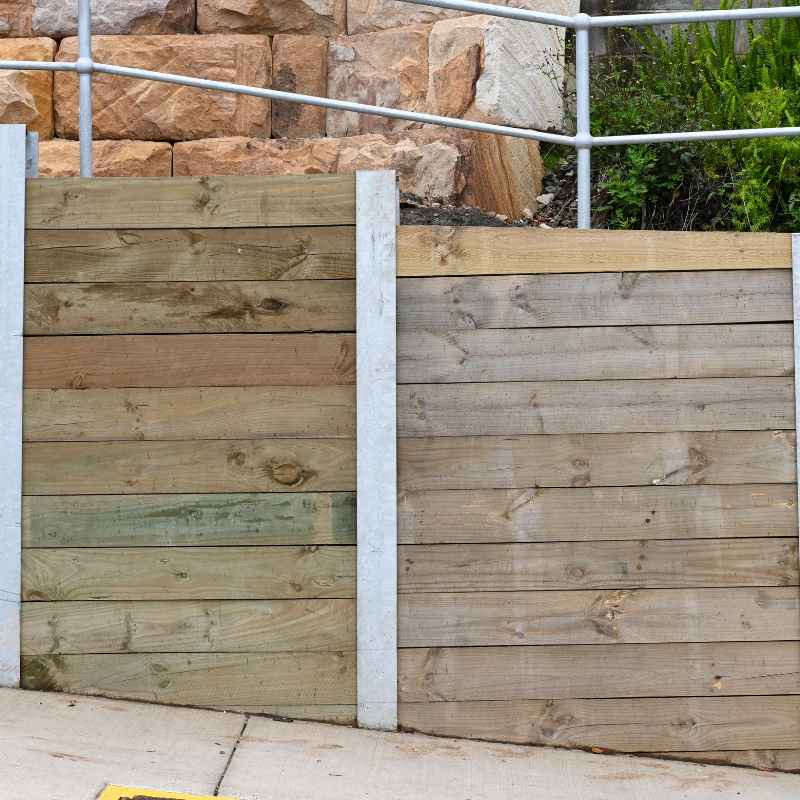 How to Build a Retaining Wall With Landscape Timbers