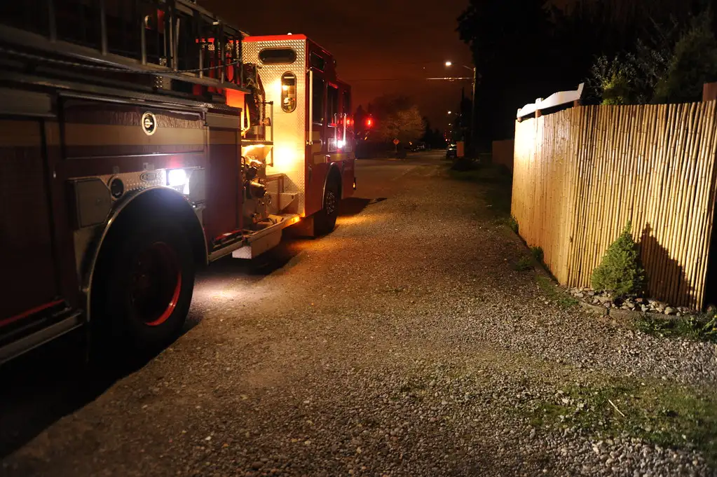 Close-up of a shielded driveway light casting focused light onto the pavement