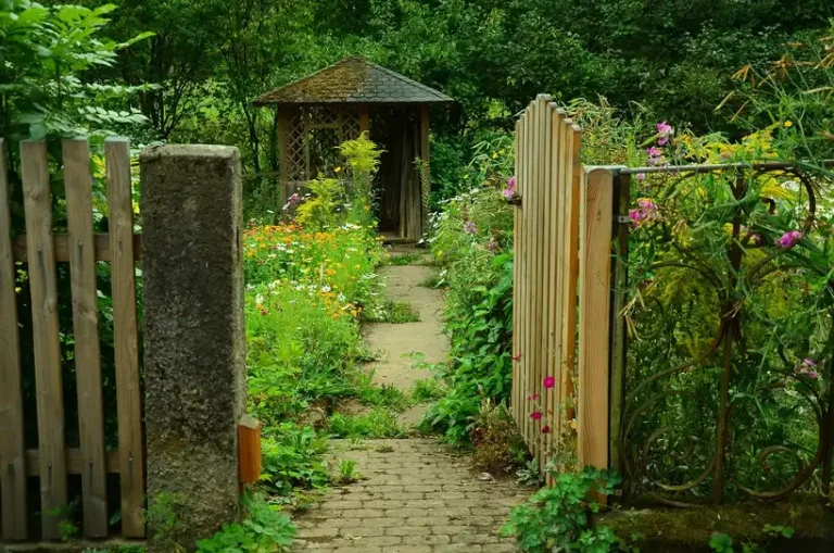 Visitors at a botanical garden entrance checking admission options and a schedule.