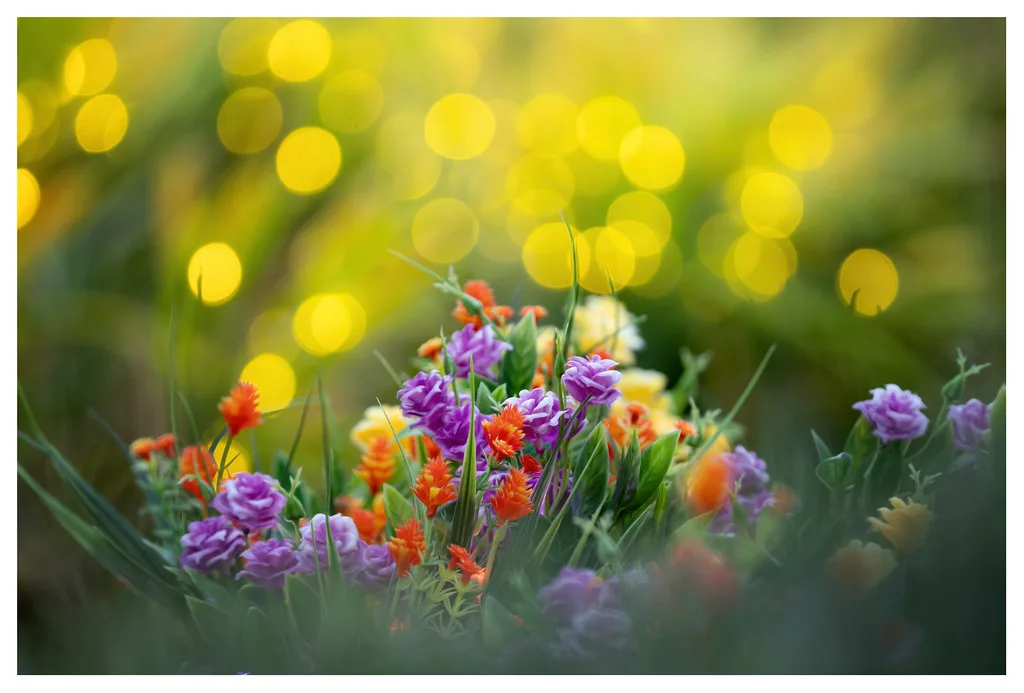 Close-up of measuring flower bed lights beside blooming plants with a tape measure.